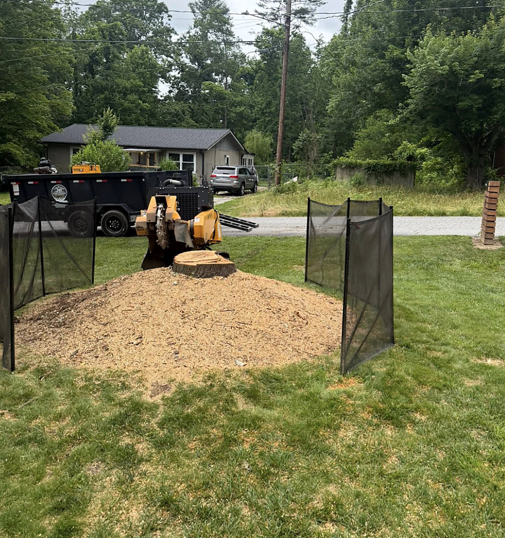 Grinding inside a temporary fenced enclosure on a lawn