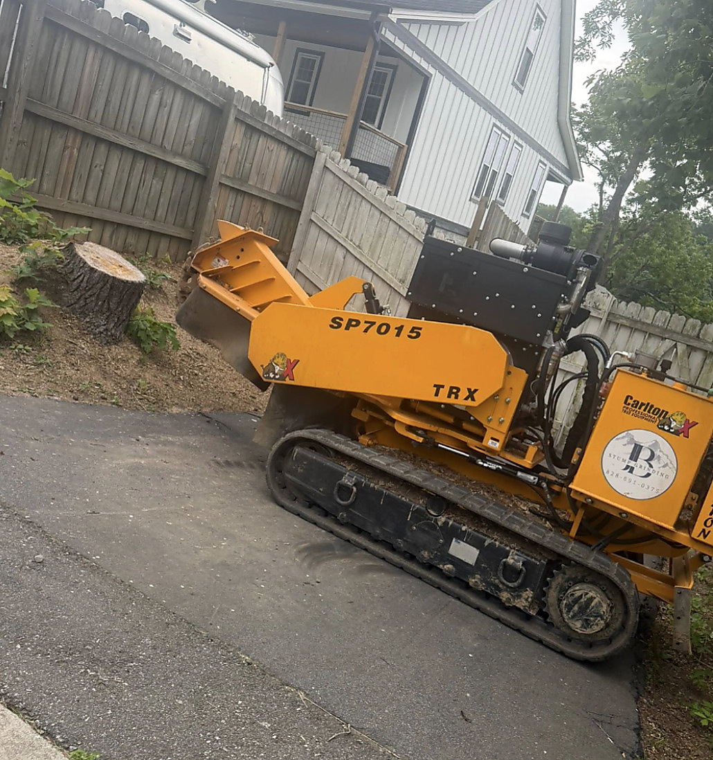 Carlton SP7015 TRX tracked stump grinder on a driveway