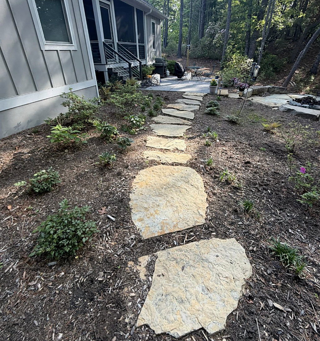 Flagstone walk running down the side of a house